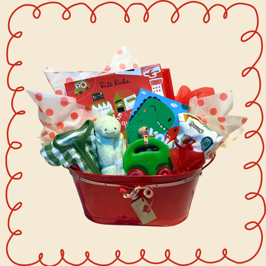 Red gift basket with toys and books